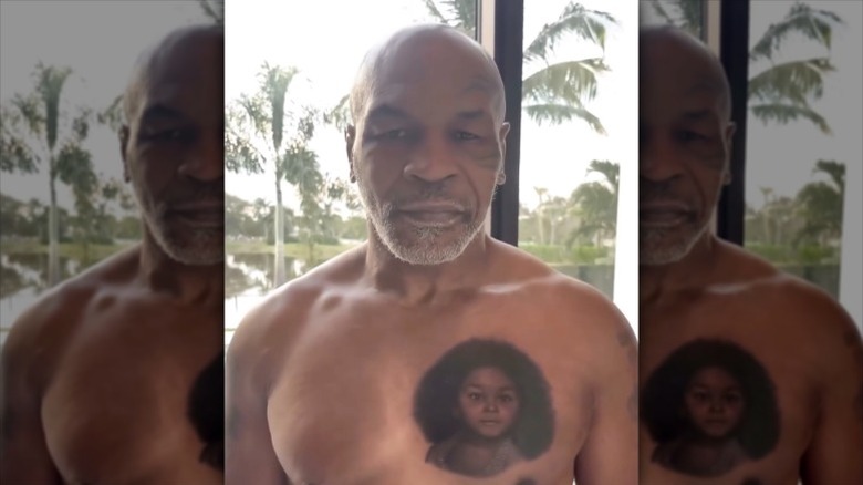 Mike Tyson displays tattoo of Exodus on his chest