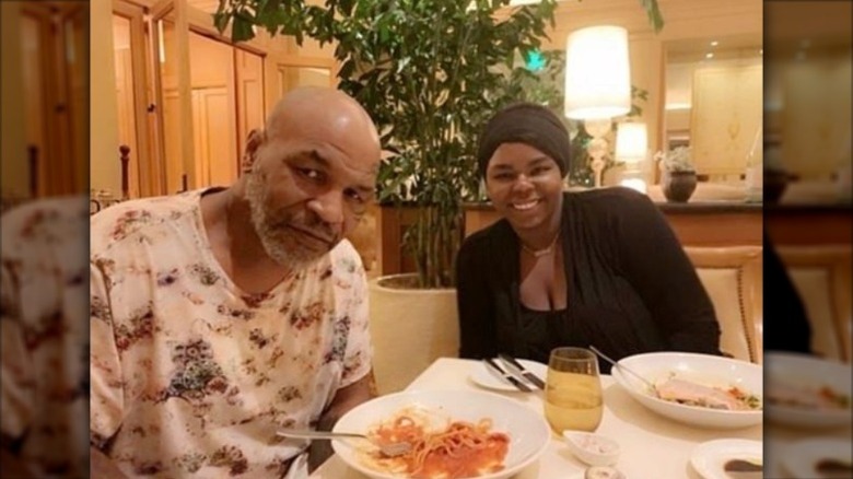 Mike Tyson at dinner table with Mikey Lorna