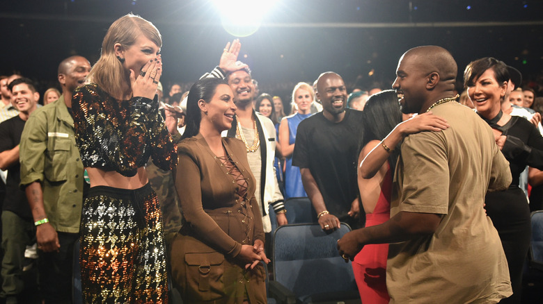 Taylor Swift, Kim Kardashian, and Kanye West smiling