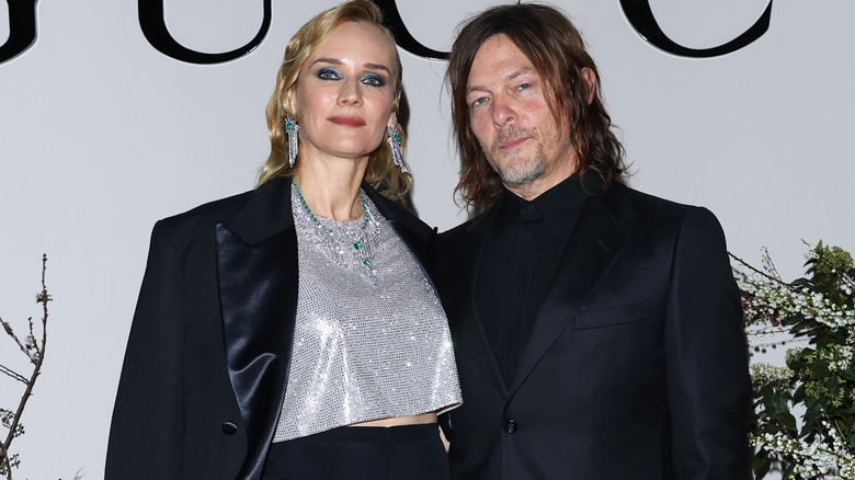 Norman Reedus posing with Diane Kruger