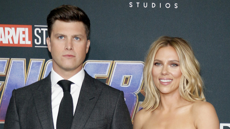 Colin Jost and Scarlett Johansson smiling