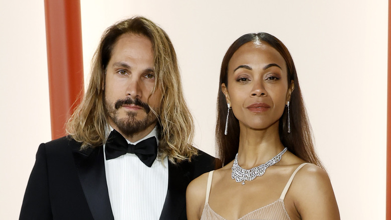 Zoë Saldana and Marco Perego posing