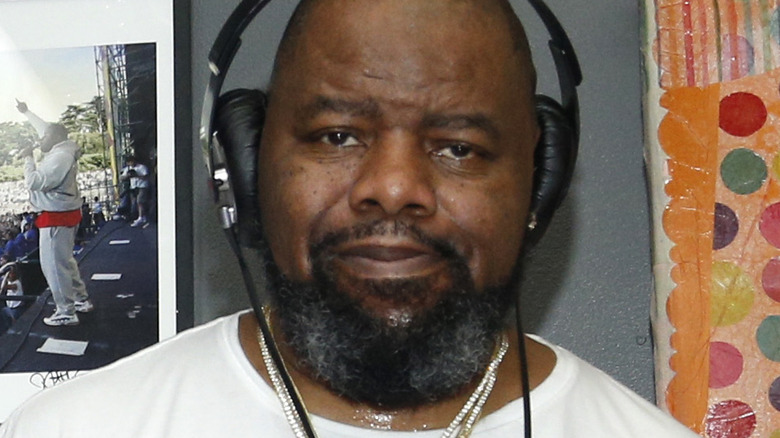 Biz Markie wearing headphones, necklaces 