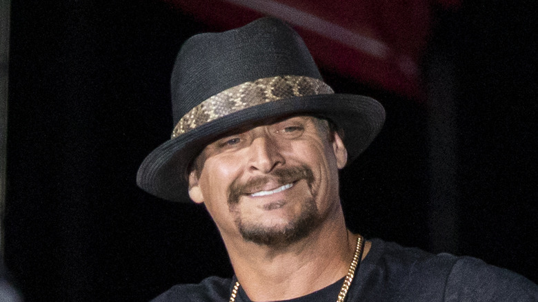 Kid Rock wearing a black fedora