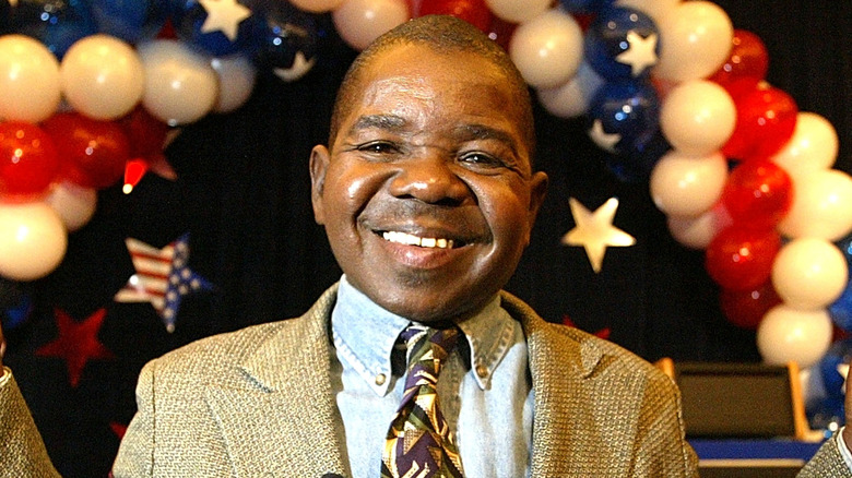 Gary Coleman in front of red, white, and blue balloons