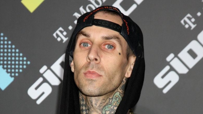 Travis Barker posing at event