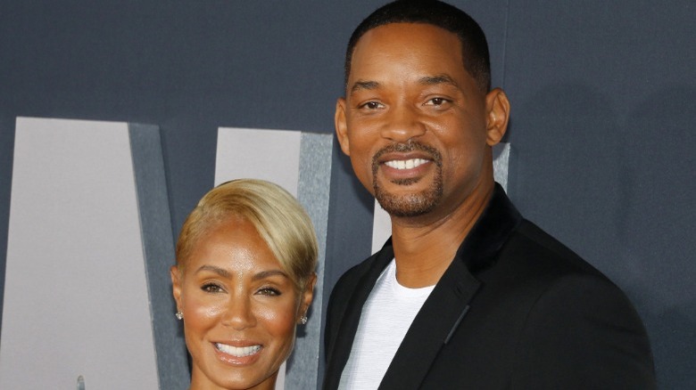 Will and Jada Smith posing on the red carpet at an event