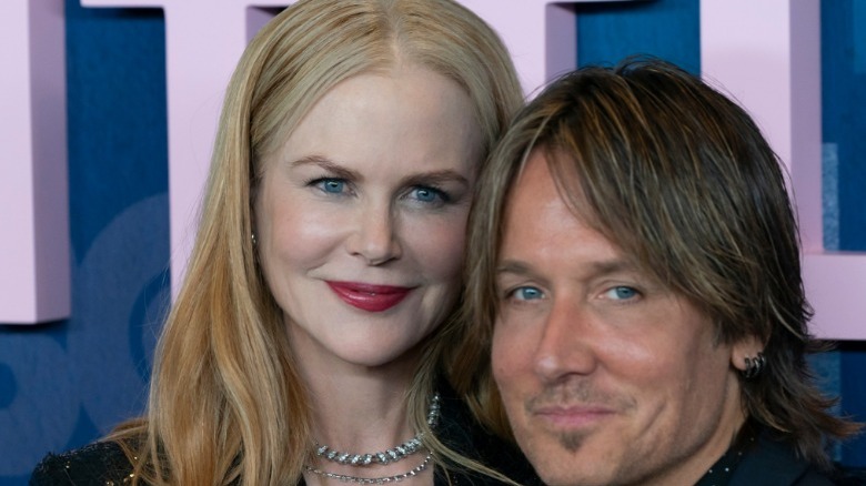 Nicole Kidman smiling above Keith Urban