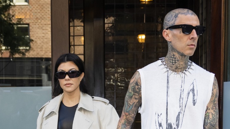 Kourtney Kardashian, Travis Barker wearing sunglasses