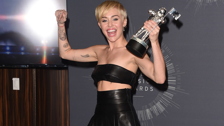 Miley Cyrus posing with her MTV Video Music Award