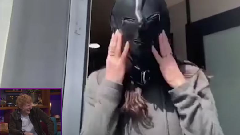 Courteney Cox wearing gimp mask