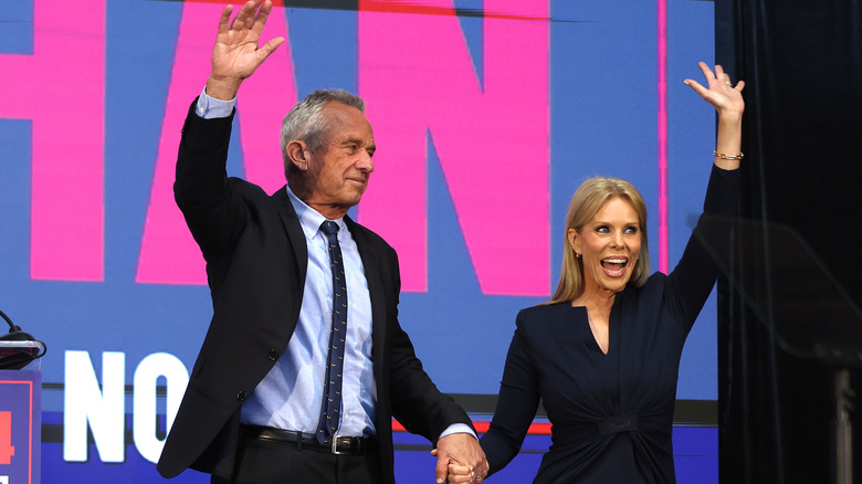 Cheryl Hines and RFK Jr. at the Henry J. Kaiser Event Center waving