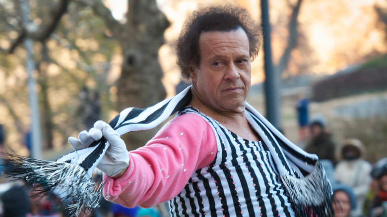 Richard Simmons wears a striped outfit 