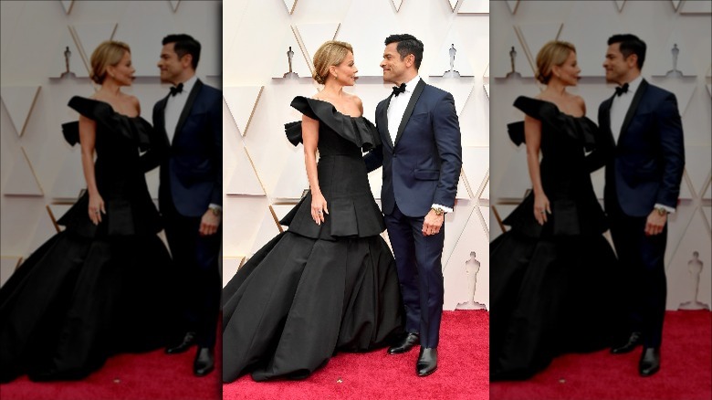 Kelly Ripa and Mark Consuelos pose side by side