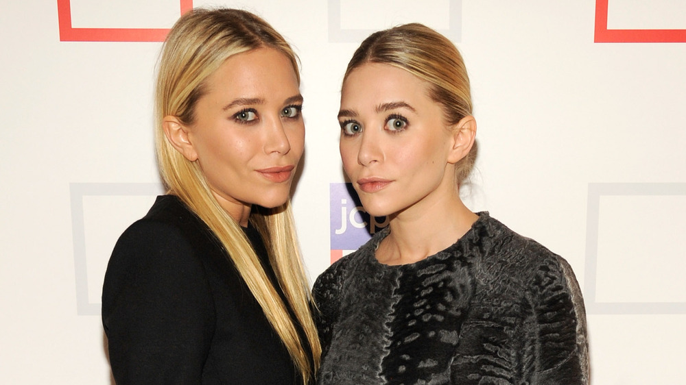 Mary-Kate and Ashley Olsen posing on the red carpet