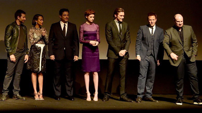 Zoë Saldaña and Bradley Cooper posing with co-stars