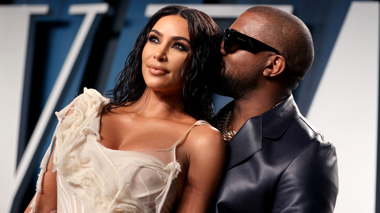 Kim Kardashian and Kanye West posing