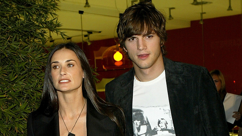 Ashton Kutcher and Demi Moore walking