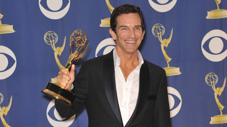 Jeff Probst holding an Emmy Award