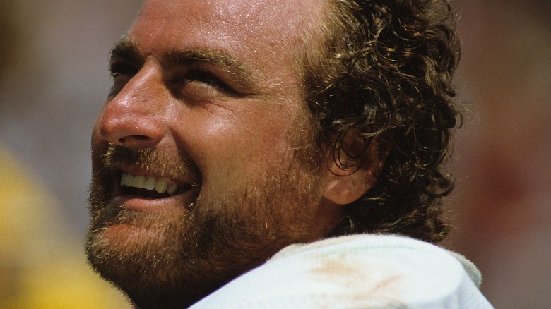 John Matuszak smiling in his football uniform.