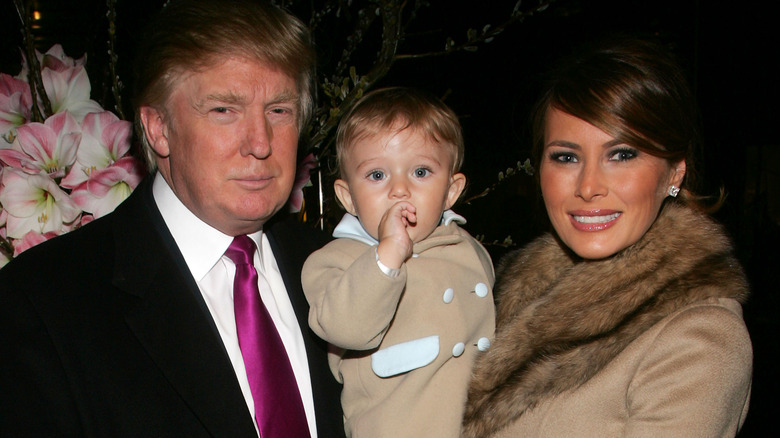 Donald and Melania Trump posing with baby Barron