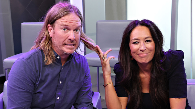 Joanna Gaines touching Chip Gaines' hair