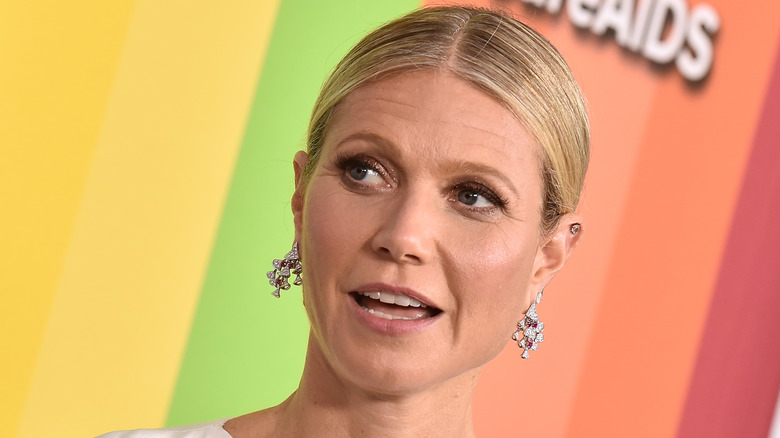 Gwyneth Paltrow speaks with her hair tied back