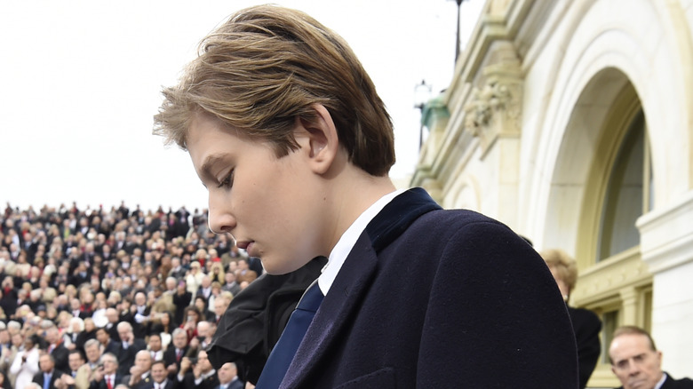 Barron Trump looking down