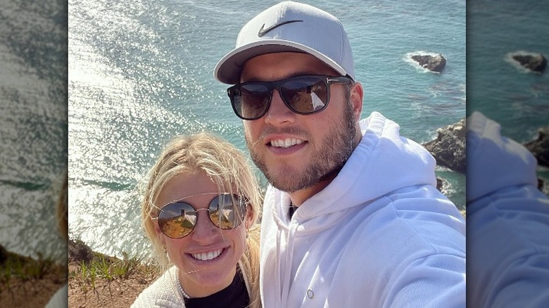 Kelly and Matthew Stafford at a beach