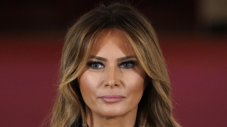 Melania Trump looks on