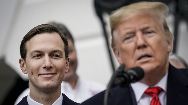 Jared Kushner watching Donald Trump speak on the South Lawn of the White House in January 2020