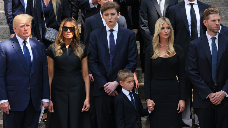 Donald, Melania, Barron, Ivanka, and Eric Trump watch as Ivana Trump's casket put in hearse