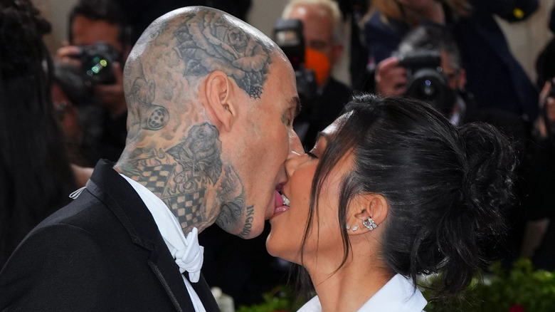 Travis Barker kissing Kourtney Kardashian