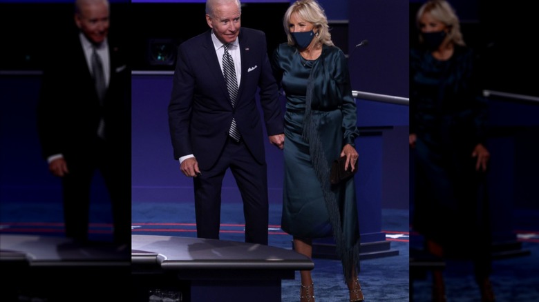 President Joe Biden and Dr. Jill Biden holding hands 