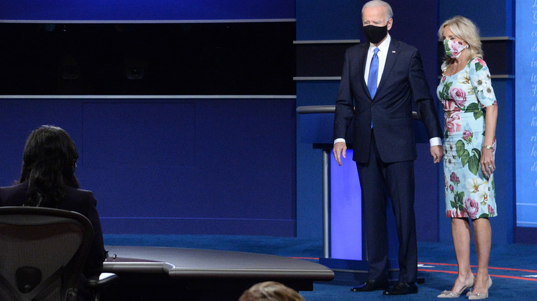 President Biden and Dr. Jill Biden holding hands 