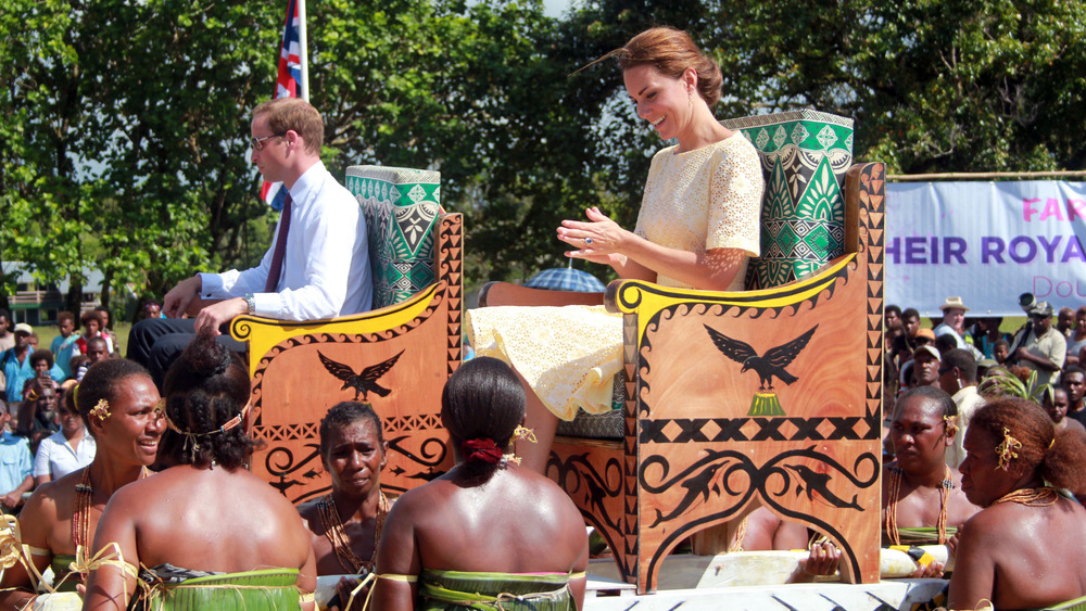 Prince William and Kate Middleton being carried in the Solomon Islands