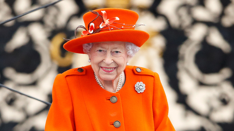 Queen Elizabeth dressed in orange