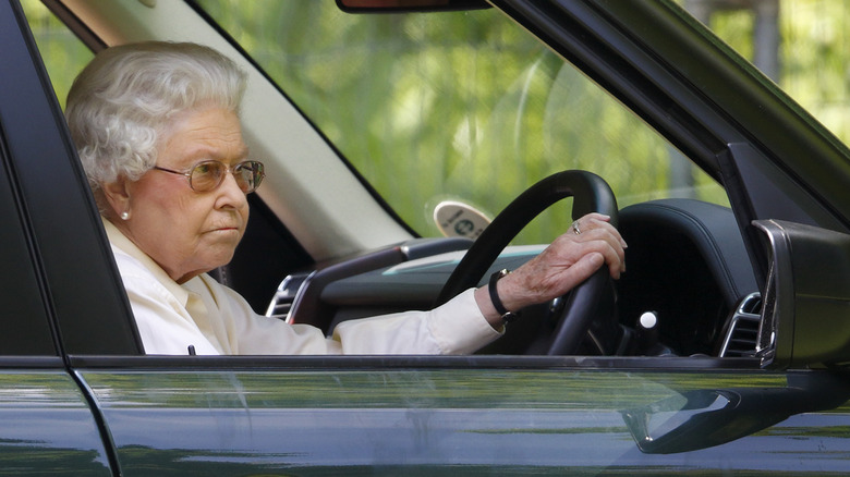 Queen Elizabeth driving a car 