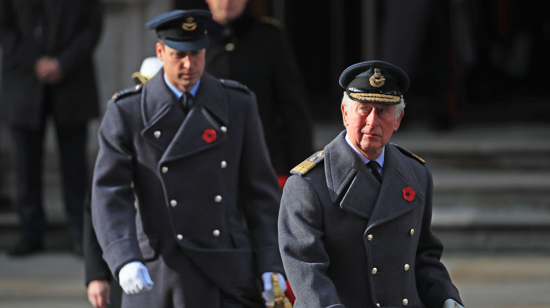 Prince William and Prince Charles walking