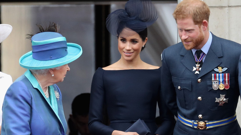 Queen Elizabeth with Meghan Markle and Prince Harry