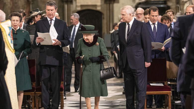 Queen Elizabeth accompanied by Prince Andrew