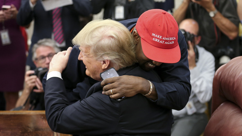 Kanye West and Donald Trump hugging