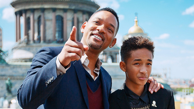 Will Smith pointing beside Jaden Smith