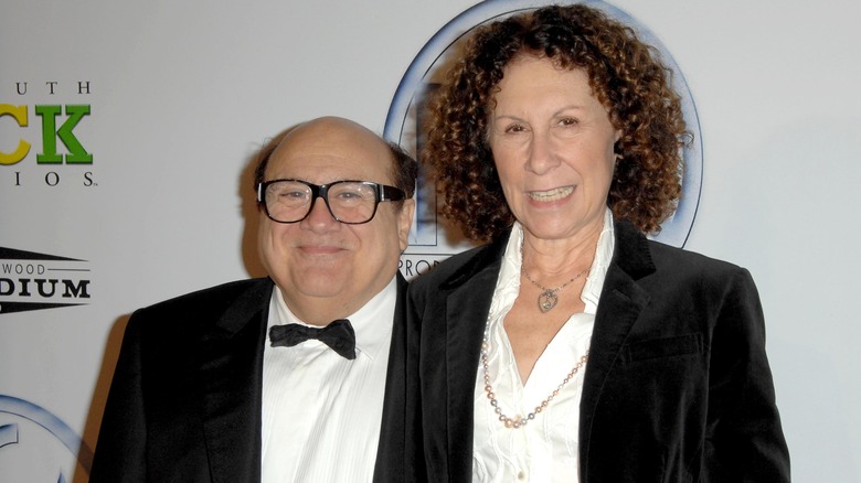 Danny DeVito and Rhea Perlman pose side by side 