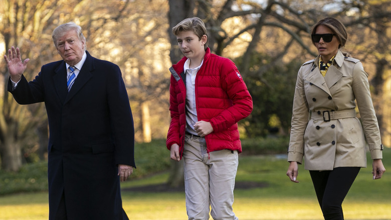 Barron Trump between his parents