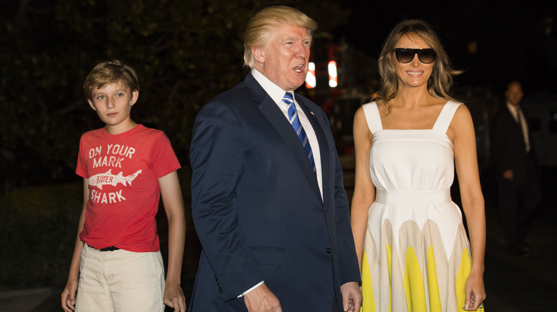 Barron Trump behind his parents