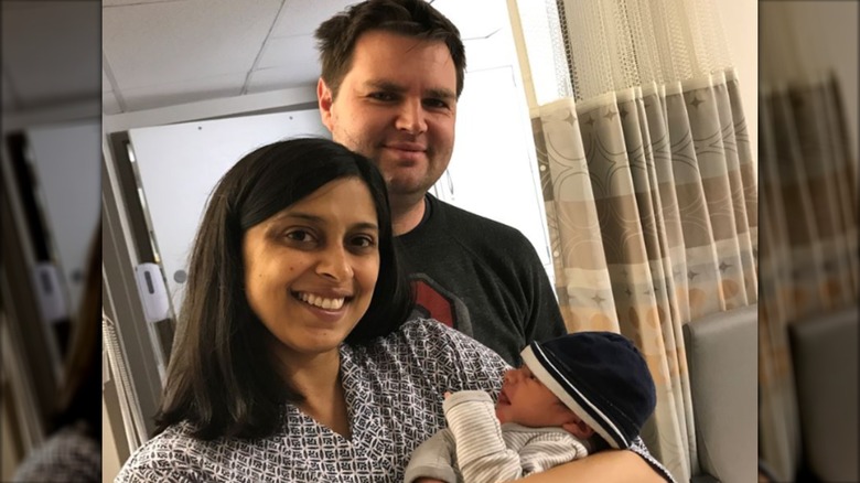 Usha and JD Vance posing with their newborn Ewan Blaine Vance.