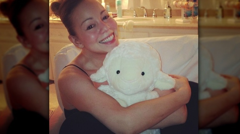 Mariah Carey holding a stuffed animal