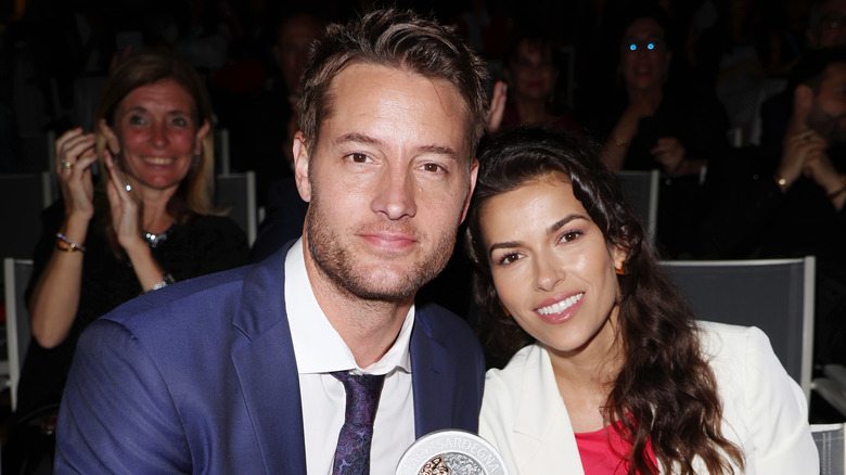 Justin Hartley and Sofia Pernas smiling and posing together