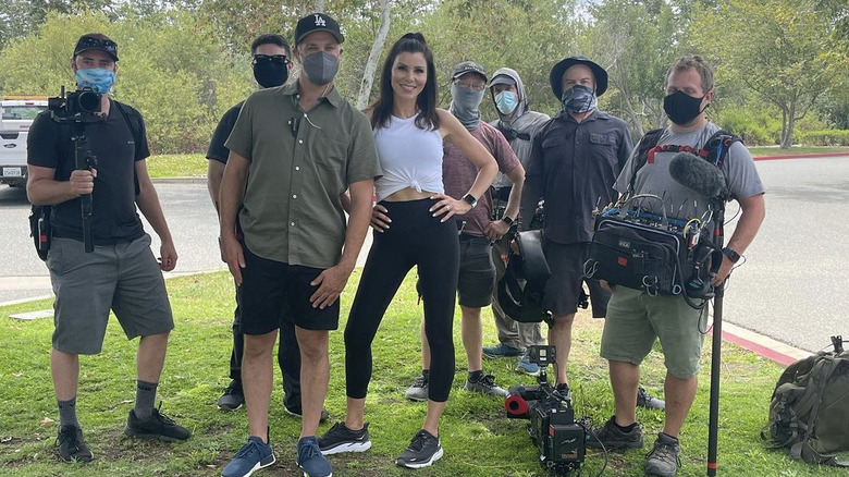 Heather Dubrow posing with film crew